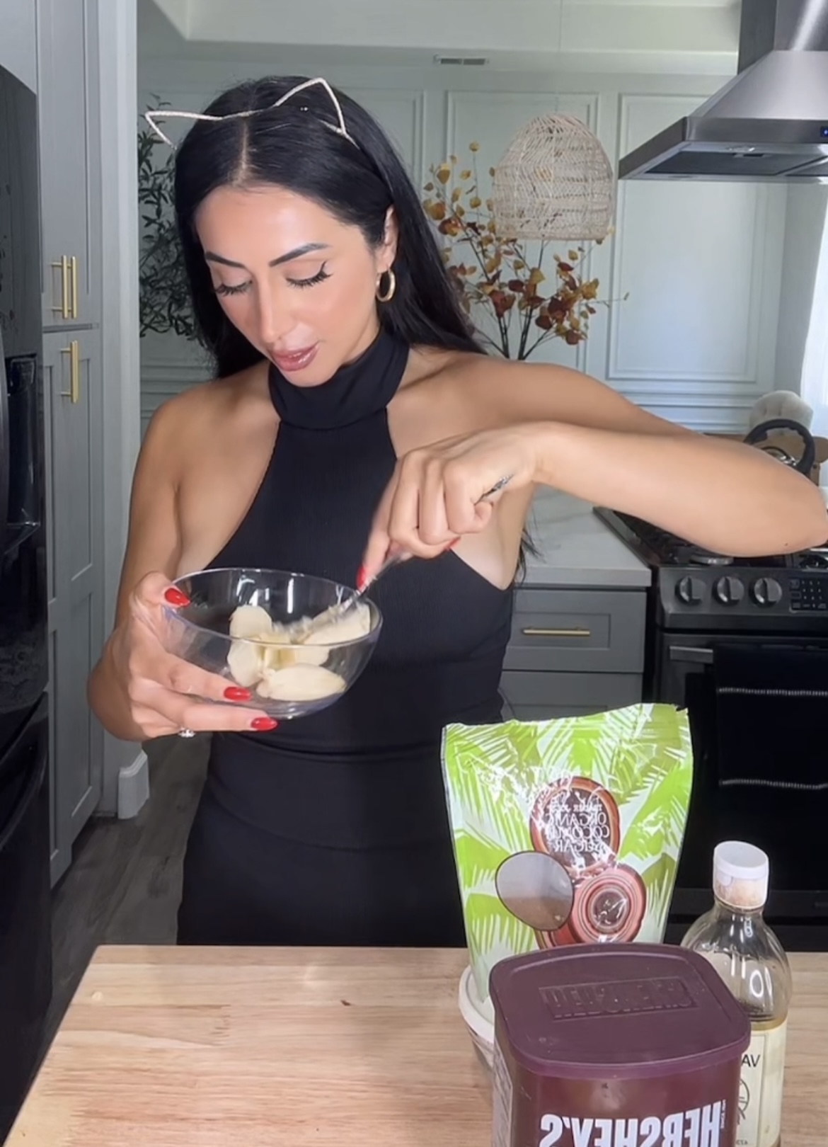 woman mashing banana in a bowl