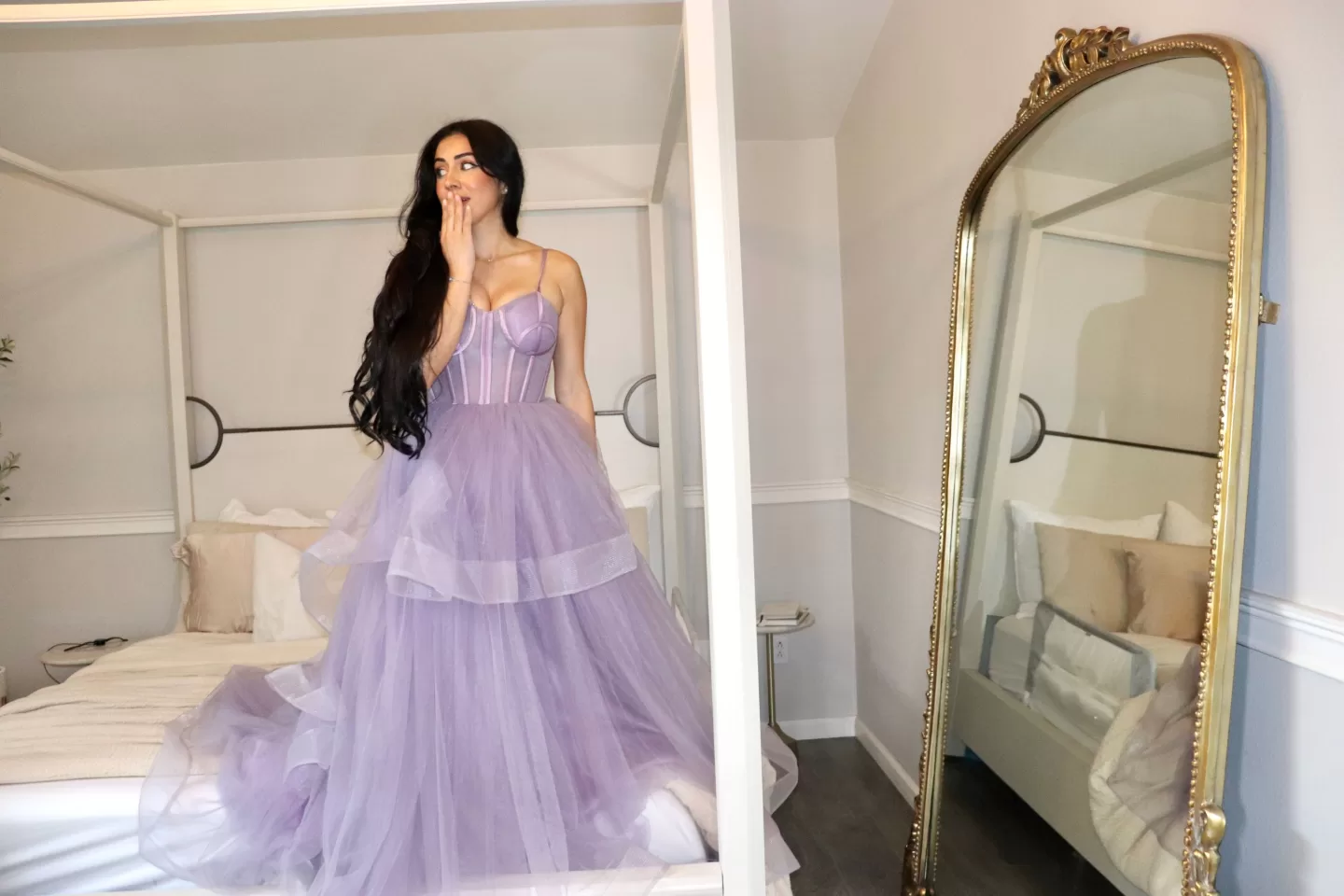 woman with long hair wearing a purple princess gown