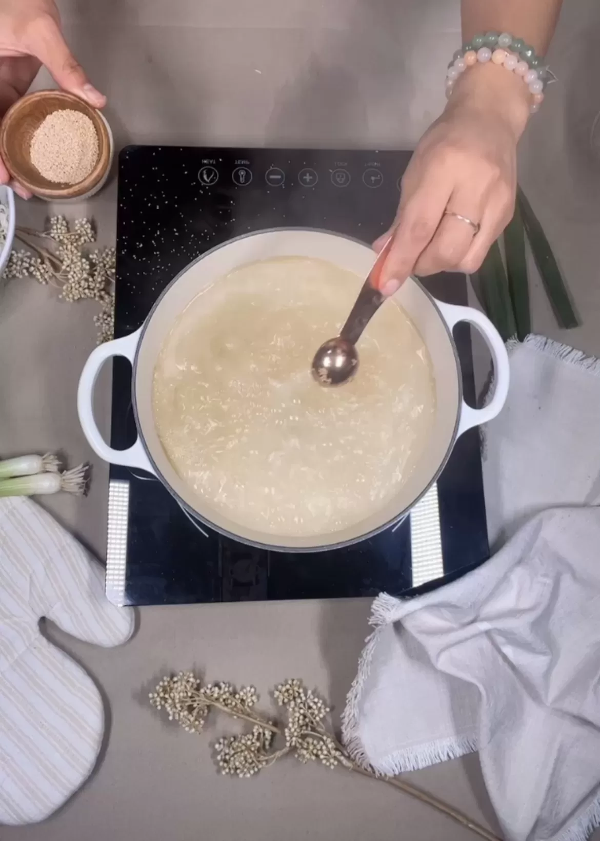 dashi powder being added to pot of boiling water
